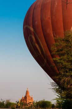 Balloon in Bagan with a golden Pagoda Myanmar Burma