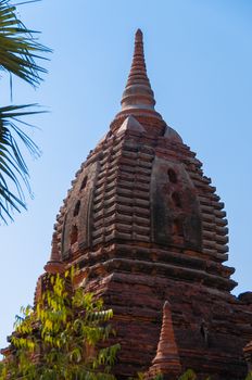 Top of red brown pagoda and blue sky in Burma Myanmar
