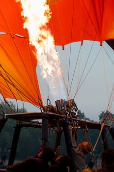 Hot air balloon crew starting fire in Bagan Myanmar Burma