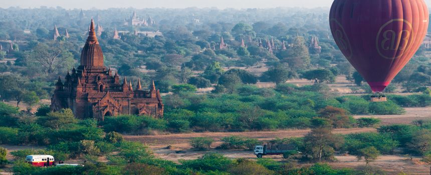 Temple and hot air balloon flying over Bagan Myanmar Burma
