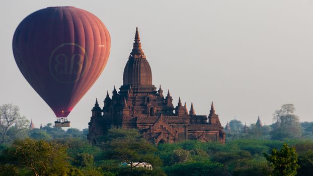 Hot air balloon behind temple in Bagan Myanmar Burma