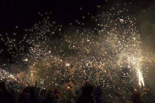 Barcelona, Spain- September 20, 2015: Fire Run or Correfoc, La Merce, Groups dress as devils and parade down the streets letting off fireworks.