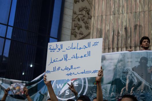EGYPT, Cairo: Protesters gathered outside the Syndicate of Journalists building in Cairo, Egypt on October 18, 2015 in a show of support for Palestinians. The activists demonstrated against the recent attacks in Jerusalem, the West Bank and Gaza. They raised the flag of Palestine as some people stood on Israel's flag in anger.