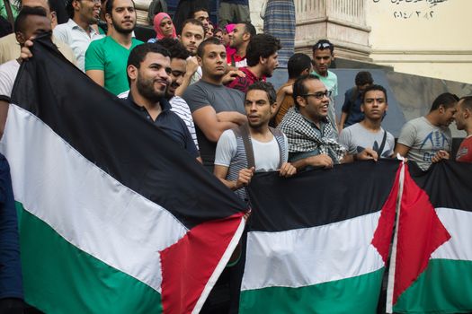 EGYPT, Cairo: Protesters gathered outside the Syndicate of Journalists building in Cairo, Egypt on October 18, 2015 in a show of support for Palestinians. The activists demonstrated against the recent attacks in Jerusalem, the West Bank and Gaza. They raised the flag of Palestine as some people stood on Israel's flag in anger.