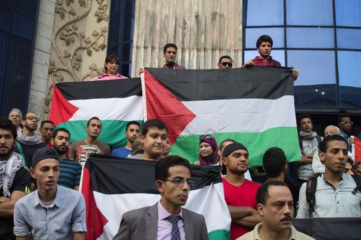 EGYPT, Cairo: Protesters gathered outside the Syndicate of Journalists building in Cairo, Egypt on October 18, 2015 in a show of support for Palestinians. The activists demonstrated against the recent attacks in Jerusalem, the West Bank and Gaza. They raised the flag of Palestine as some people stood on Israel's flag in anger.
