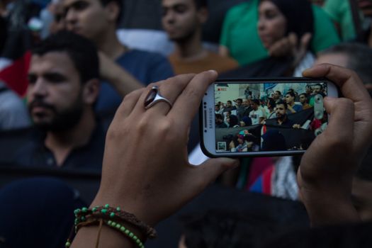 EGYPT, Cairo: Protesters gathered outside the Syndicate of Journalists building in Cairo, Egypt on October 18, 2015 in a show of support for Palestinians. The activists demonstrated against the recent attacks in Jerusalem, the West Bank and Gaza. They raised the flag of Palestine as some people stood on Israel's flag in anger.