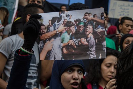EGYPT, Cairo: Protesters gathered outside the Syndicate of Journalists building in Cairo, Egypt on October 18, 2015 in a show of support for Palestinians. The activists demonstrated against the recent attacks in Jerusalem, the West Bank and Gaza. They raised the flag of Palestine as some people stood on Israel's flag in anger.
