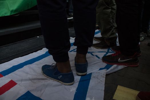 EGYPT, Cairo: Protesters gathered outside the Syndicate of Journalists building in Cairo, Egypt on October 18, 2015 in a show of support for Palestinians. The activists demonstrated against the recent attacks in Jerusalem, the West Bank and Gaza. They raised the flag of Palestine as some people stood on Israel's flag in anger.