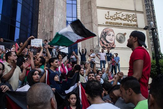 EGYPT, Cairo: Protesters gathered outside the Syndicate of Journalists building in Cairo, Egypt on October 18, 2015 in a show of support for Palestinians. The activists demonstrated against the recent attacks in Jerusalem, the West Bank and Gaza. They raised the flag of Palestine as some people stood on Israel's flag in anger.