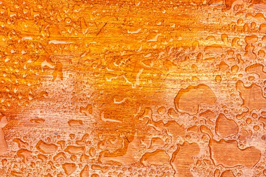 Abstract raindrops pattern on wooden board .