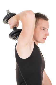 Sporty young man doing exercise to strengthen his triceps with dumbbells.