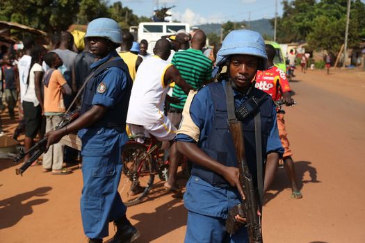 CENTRAL AFRICAN REPUBLIC, Bangui : Soldiers of the United Nations Multidimensional Stabilization Mission in Central African Republic, Minusca, passe on a street in Bangui, as they patrol in the city, on October 18, 2015. The Central African Republic descended into bloodshed more than two years ago after long time president Francois Bozize, a Christian, was ousted by Seleka rebels, triggering the worst crisis since independence in 1960. On September 29, 2015, Bangui returned to only relative calm after three days of inter-community violence which left at least 40 dead and 100 injured according to the UN Refugee Agency UNHCR. Some 27,000 inhabitants of Bangui have also fled to displaced people's camps