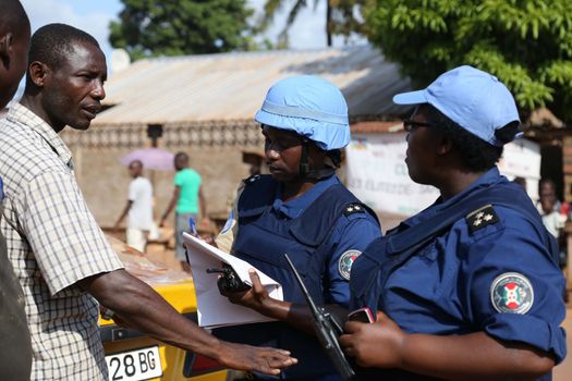 CENTRAL AFRICAN REPUBLIC, Bangui : Soldiers of the United Nations Multidimensional Stabilization Mission in Central African Republic, Minusca, passe on a street in Bangui, as they patrol in the city, on October 18, 2015. The Central African Republic descended into bloodshed more than two years ago after long time president Francois Bozize, a Christian, was ousted by Seleka rebels, triggering the worst crisis since independence in 1960. On September 29, 2015, Bangui returned to only relative calm after three days of inter-community violence which left at least 40 dead and 100 injured according to the UN Refugee Agency UNHCR. Some 27,000 inhabitants of Bangui have also fled to displaced people's camps