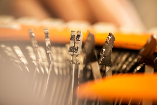 Close-up Detail of Type Bars on old typewriter.