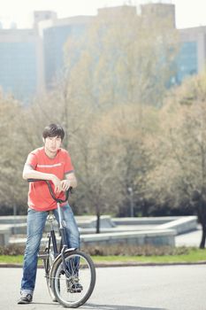 Asiam man standing with biker in the city