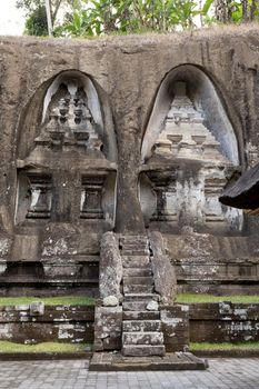 unung Kawi Temple. Gunug Kawi is an ancient temple situated in Pakerisan River, near Tampaksiring village in Bali. The archaeological complex is carved out of the living rock, dating to 11th century.
