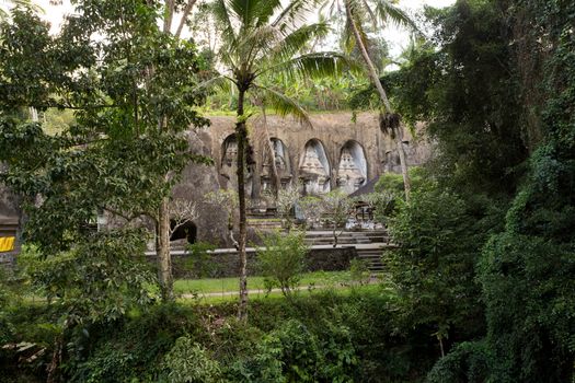 unung Kawi Temple. Gunug Kawi is an ancient temple situated in Pakerisan River, near Tampaksiring village in Bali. The archaeological complex is carved out of the living rock, dating to 11th century.