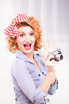 Portrait of elegant retro style woman/housewife with photo camera.