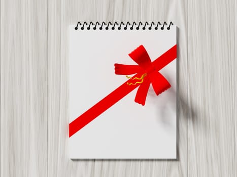 Note paper wrapped with color ribbon, on color wooden background