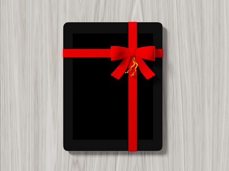 tablet wrapped with color ribbon, on color wooden background