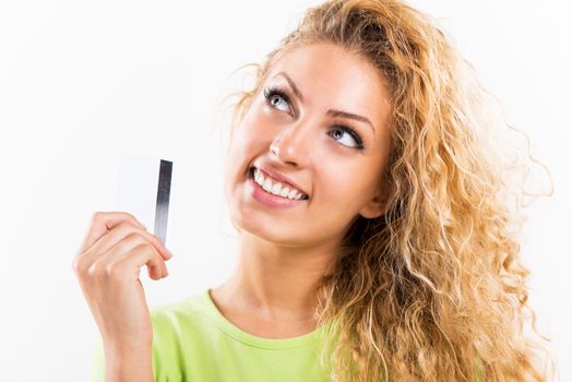 Portrait of beautiful young woman with credit card. White background.