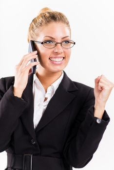 Portrait of attractive businesswoman using a mobile phone. She is happy.