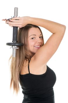 Sporty young woman doing exercise to strengthen her triceps with dumbbells.