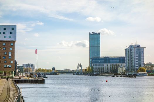 Berlin, Germany - October 29, 2013: View of river Spree from bridge Oberbaumbruecke towards Treptower Park.