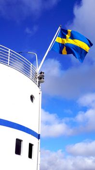 Ship and Sweden’s flag in Stockholm, Europe
