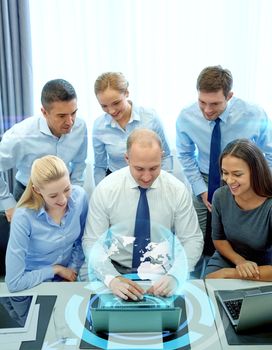 business, people, technology and teamwork concept - smiling business team with laptop computer and virtual projection working in office