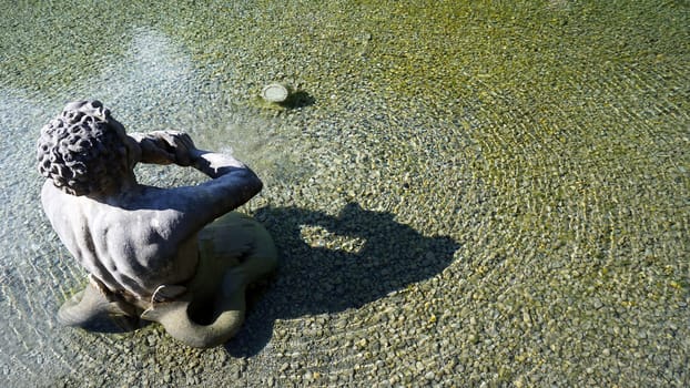 Sculpture in the pool in Hellbrunn palace garden in Salzburg, Austria