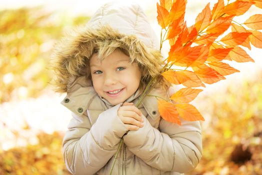 Portrait of cute little girl on beautiful autumn day. 