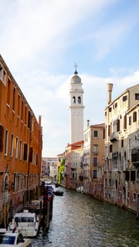 Scene of canal and boat with ancient architecture in Venice, Italy