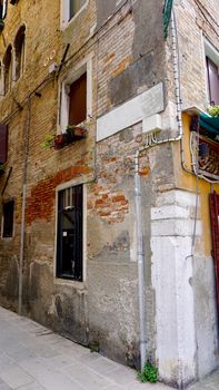 alley of old building with brick material in old town city Venice, Italy