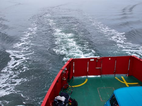 Ferry boat for people and cars sailing on the ocean sea