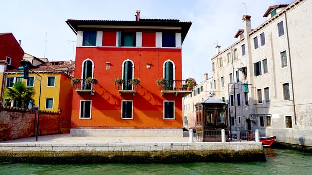 red ancient house building in old town city Venice, Italy
