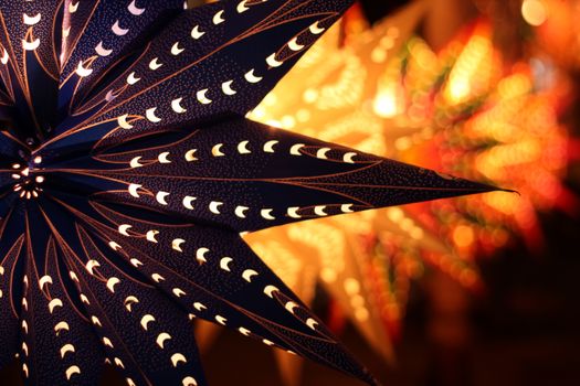 A traditional lantern on the backdrop of other lanterns lit on the ocassion of Diwali festival in India.