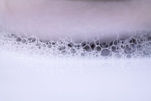 Structure of White Foam bubbles abstract texture on white background.