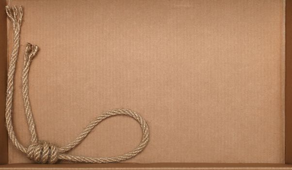 Rope on cardboard texture background