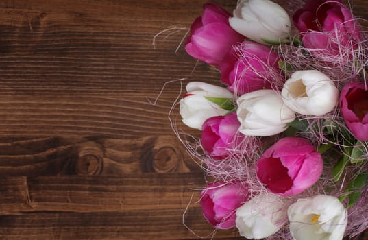 tulip bouquet on wood background