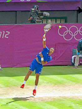 WIMBLEDON, ENGLAND - August 2nd, 2012 - Jo-Wilfried Tsonga during one of his singles matches at the summer Olympics in London in 2012. He made it to the quarterfinals in the tournament.