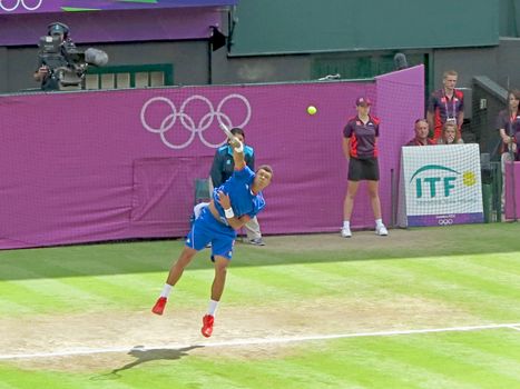 WIMBLEDON, ENGLAND - August 2nd, 2012 - Jo-Wilfried Tsonga during one of his singles matches at the summer Olympics in London in 2012. He made it to the quarterfinals in the tournament.