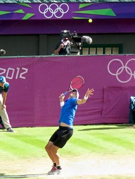 WIMBLEDON, ENGLAND - August 2nd, 2012 - John Isner during one of his singles matches at the summer Olympics in London in 2012. He made it to the quarterfinals in the tournament.