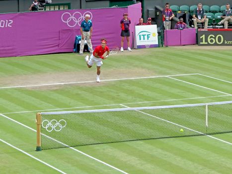 WIMBLEDON, ENGLAND - August 2nd, 2012 - Roger Federer during one of his singles matches at the summer Olympics in London in 2012. He came 2nd and won the silver medal in the tournament.