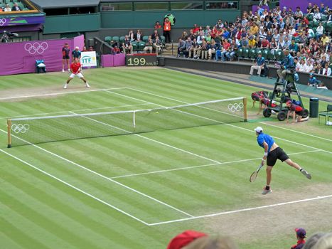 WIMBLEDON, ENGLAND - August 2nd, 2012 � Roger Federer and John Isner during their singles matches at the summer Olympics in London in 2012. Roger Federer came 2nd, silver medal and John Isner made it to the quarterfinals in the tournament