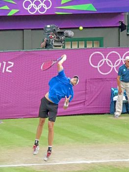 WIMBLEDON, ENGLAND - August 2nd, 2012 - John Isner during one of his singles matches at the summer Olympics in London in 2012. He made it to the quarterfinals in the tournament.