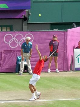 WIMBLEDON, ENGLAND - August 2nd, 2012 - Roger Federer during one of his singles matches at the summer Olympics in London in 2012. He came 2nd and won the silver medal in the tournament.