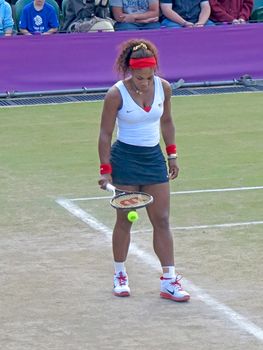 WIMBLEDON, ENGLAND - August 2nd, 2012 � Serena Williams during one of her doubles matches at the summer Olympics in London in 2012. Serena and Venus Williams went on to win the women�s doubles and take home the gold medal.
