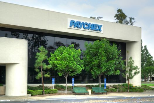 COSTA MESA, CA/USA - OCTOBER 17, 2015: Paychex corporate building. Paychex, Inc. is a provider of payroll, human resource, and benefits outsourcing solutions.