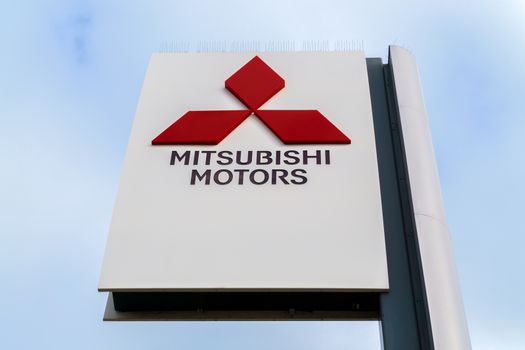 COSTA MESA, CA/USA - OCTOBER 17, 2015: Mitsubishi Motors Autombile Dealership Sign. Mitsubishi is a Japanese manufacturer of automobiles and commercial vehicles.